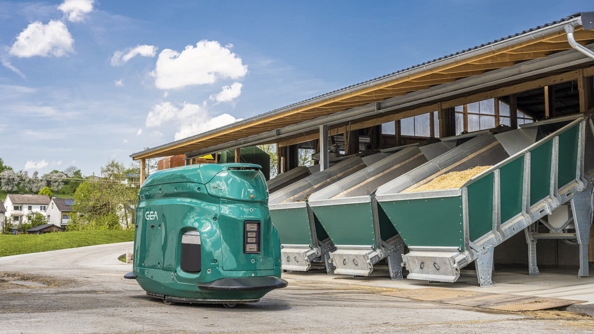 GEA DairyFeed F4500 feeding robot alongside feed bunkers.