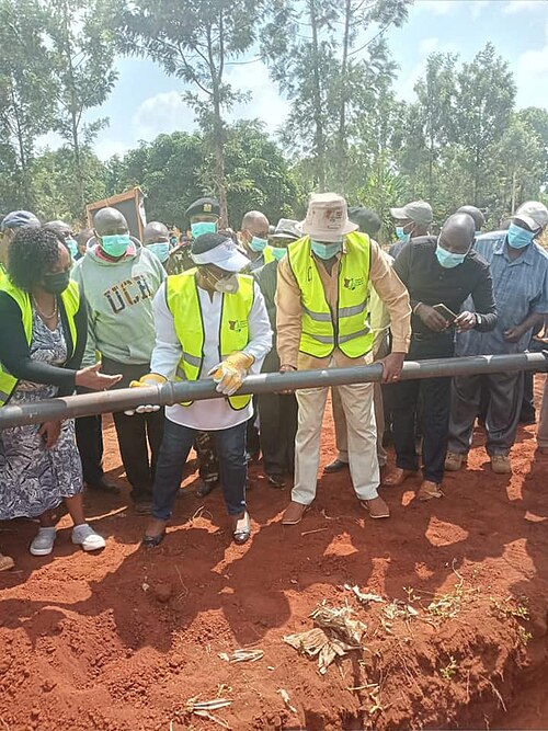 Participants laying a pipe for a community irrigation project in Kenya