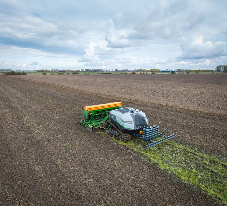 Tracked AgXeed AgBot T2 7 Series working in a field.