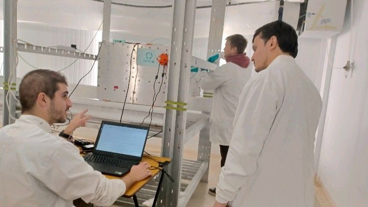 SoftGrip researchers assembling and testing equipment in a growing facility