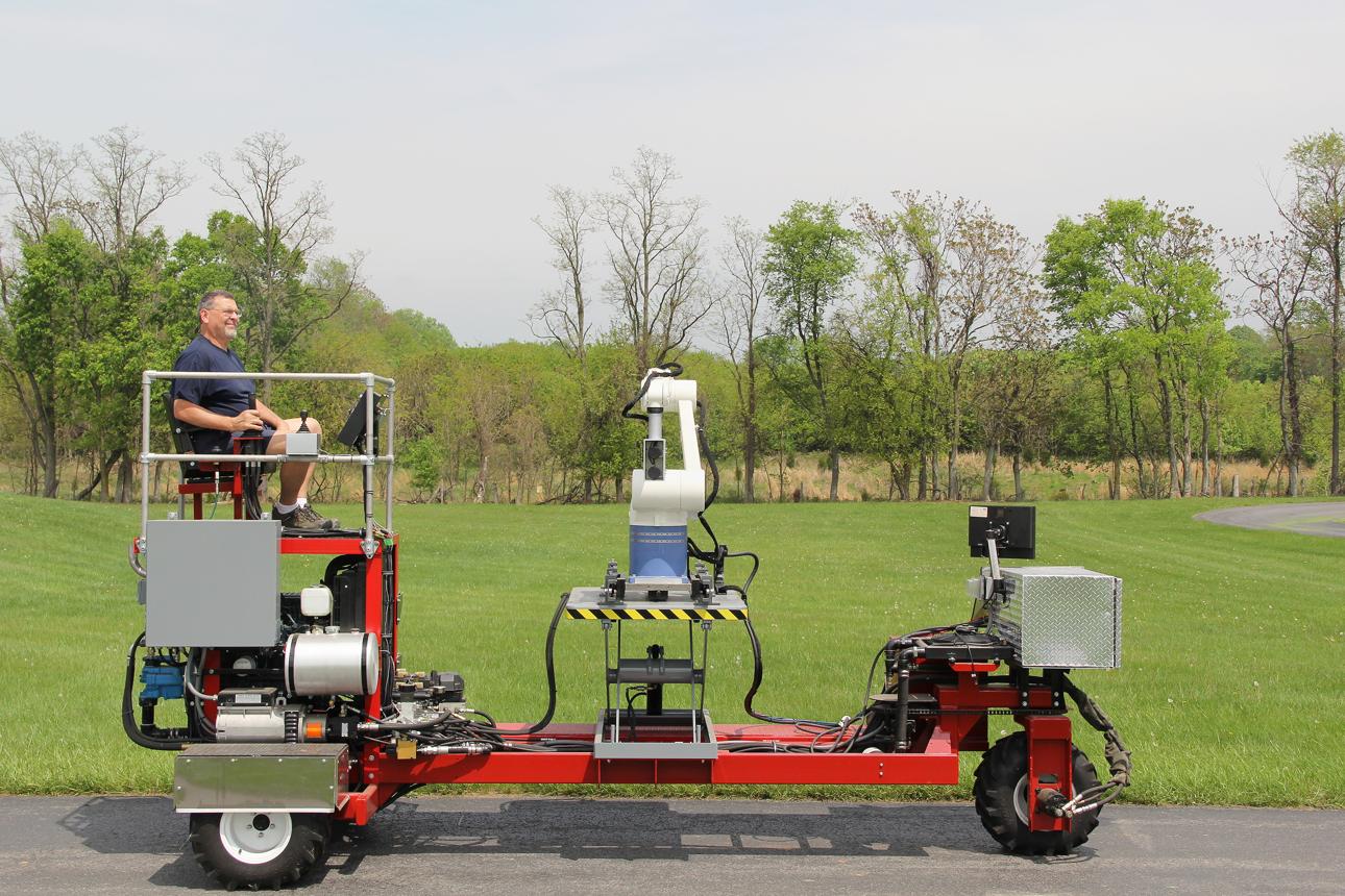 USDA ARS technician Scott Wolford operating the Robotic System for Tree Shape Estimation (RoTSE).