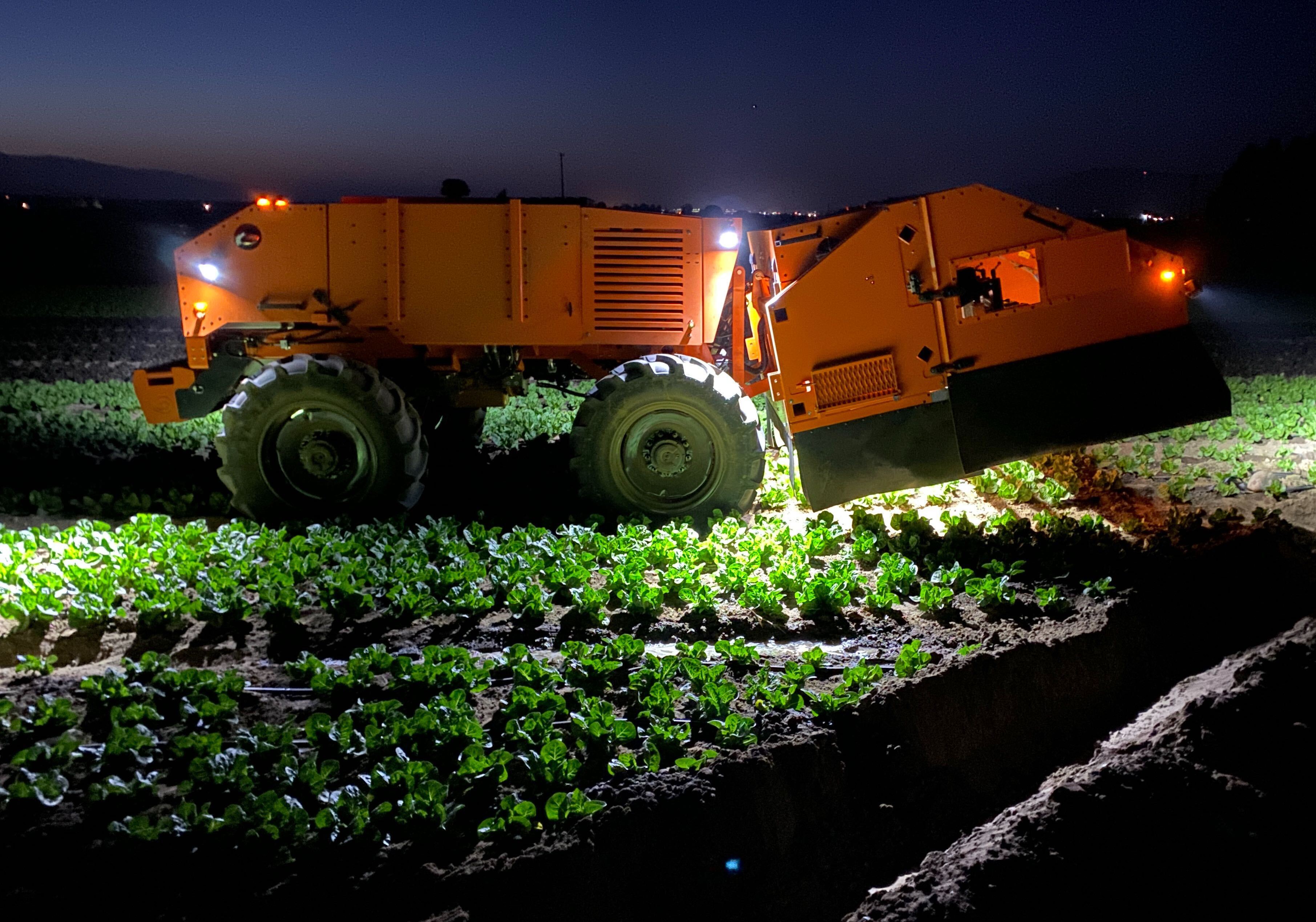 FarmWise Titan FT-35 autonomous weeding robot operating in a lettuce field.