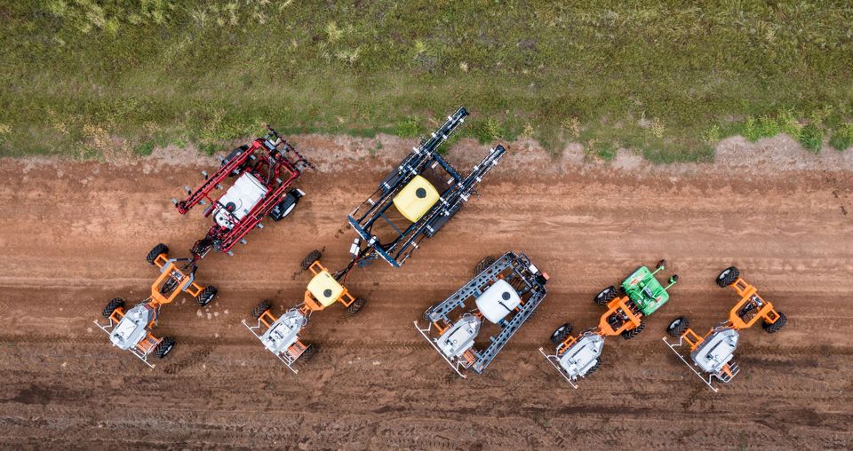 Several SwarmFarm robots and implements seen from above.