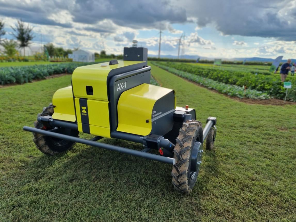 Real Kilter AX-1 autonomous precision weeding robot in an agricultural field