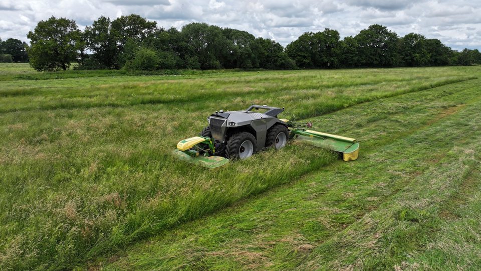 KRONE autonomous mowing machine working in a grass field.