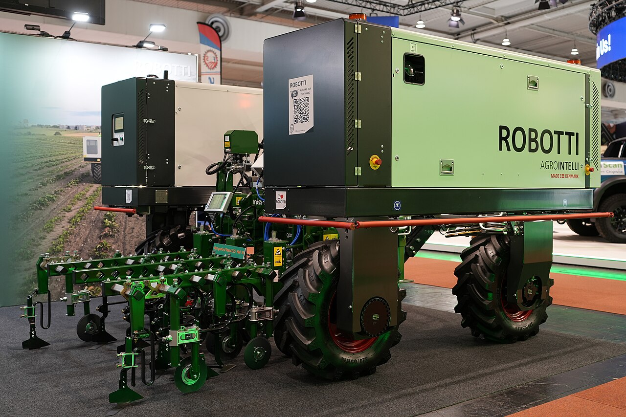 An Agrointelli ROBOTTI implement carrier displayed with a Garford hoe at Agritechnica 2025.