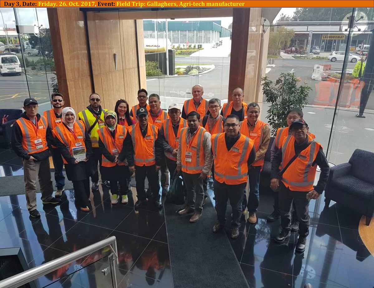 Study-tour participants wearing safety vests during an industrial visit
